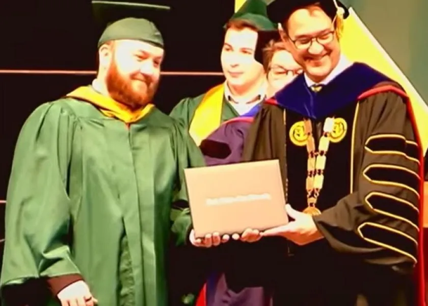 Jack receiving his MS degree.