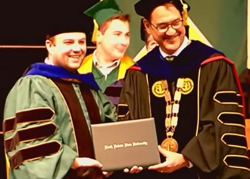 Jacob receiving his PhD.