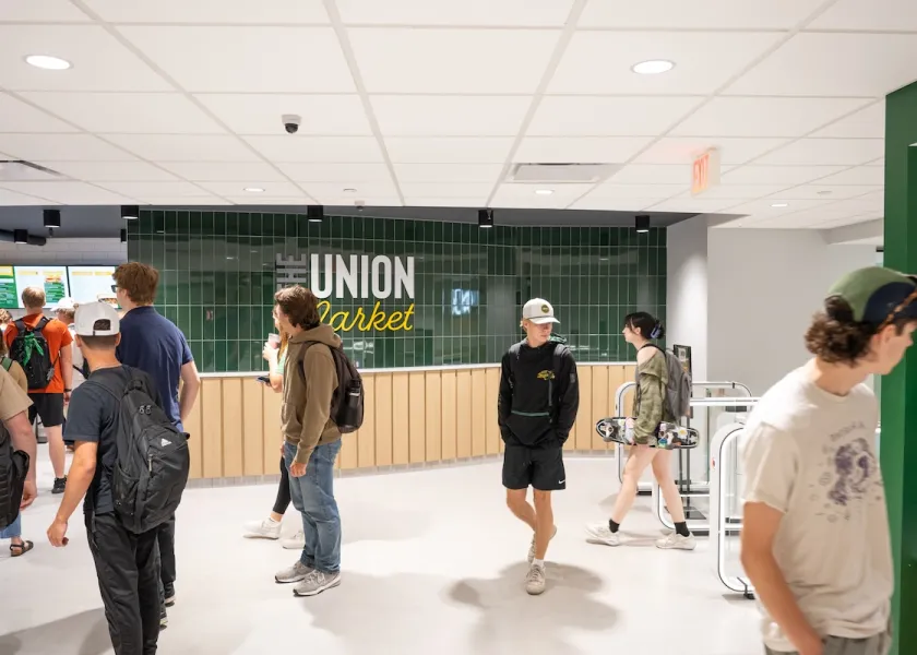 Students walk around the new Union Market.