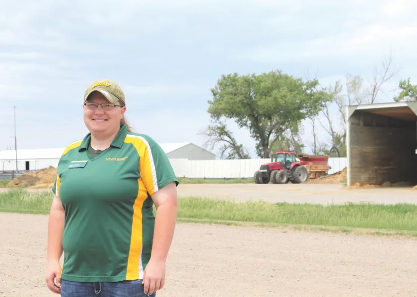 Angie Johnson outside at an Extension station.