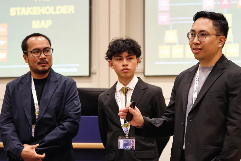 NDSU student Marcel Roy Domalanta and his team presents to a crowd at Map the System in Oxford, England.