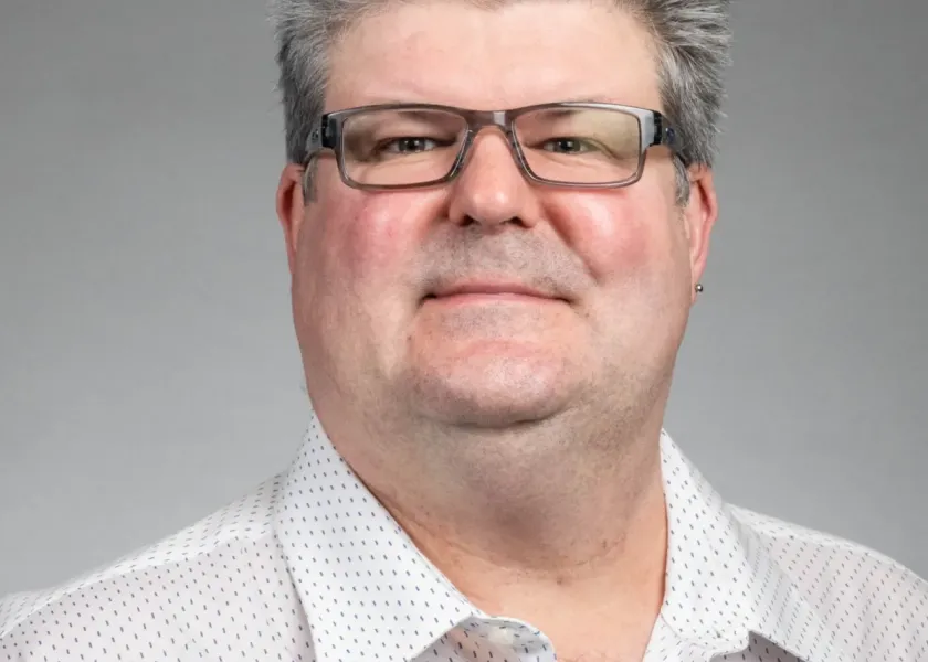 Chris Colbert looking confidently at camera.