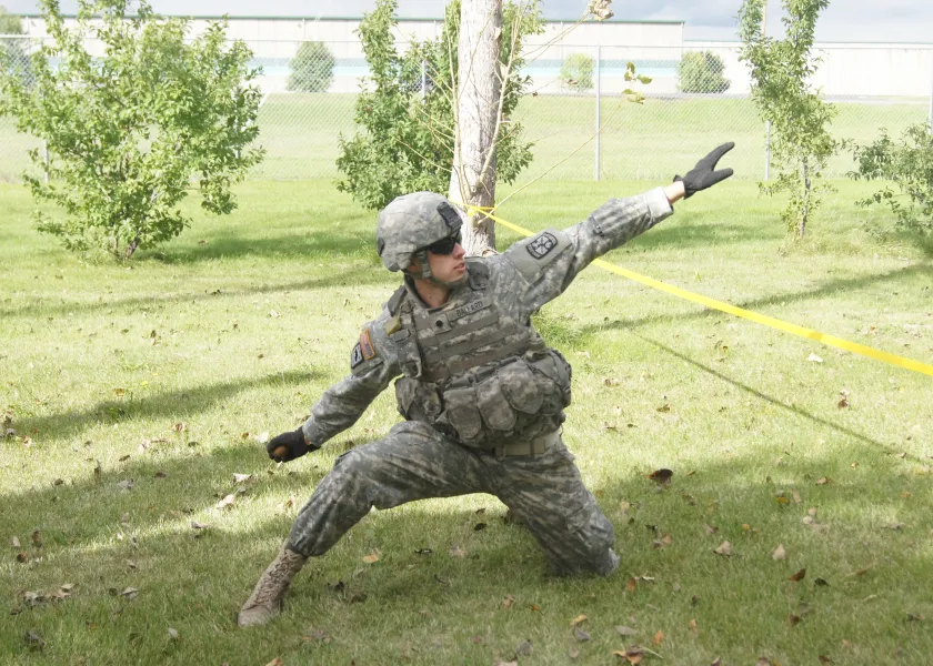 Army ROTC Cadet throwing a practice grenade during Leadership Lab.
