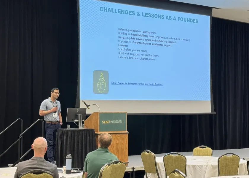 A researcher gives a presentation in the NDSU Memorial Union's Ballroom at the 8th Annual North Dakota Biomedical Engineering Symposium.