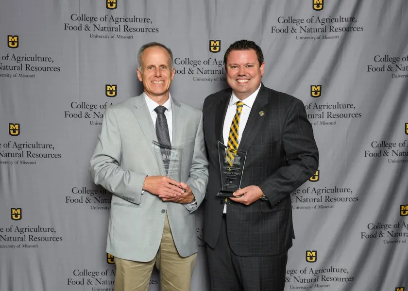 Greg Lardy receiving his award.