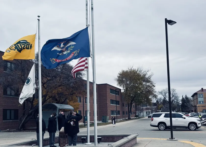 Members of the Honor Guard from Fargo VFW Post 762 performed a brief flag-raising ceremony in front of the Memorial Union.