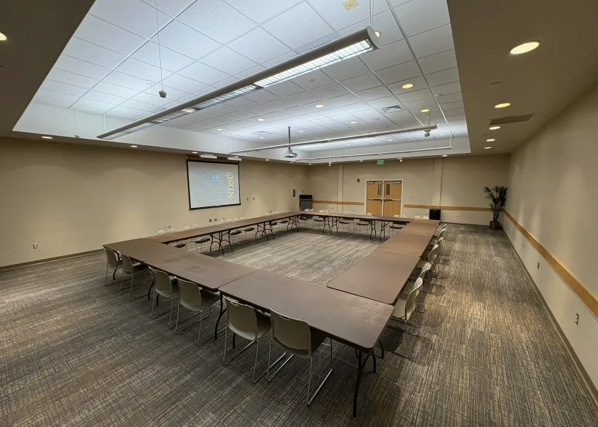 Sahnish room with open square table arrangement