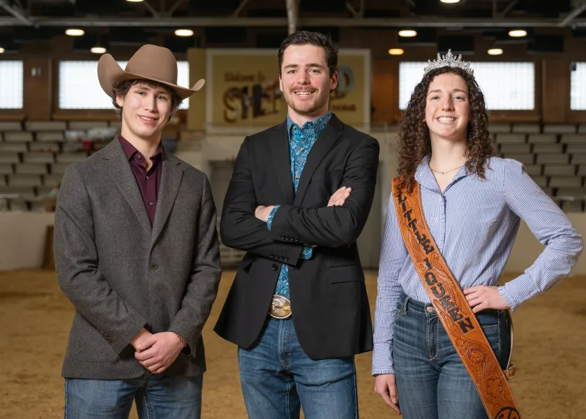 Students Taiton Axtman, Koen Helmuth and Linnea Axtman pose for a photo in the Shepperd Arena.