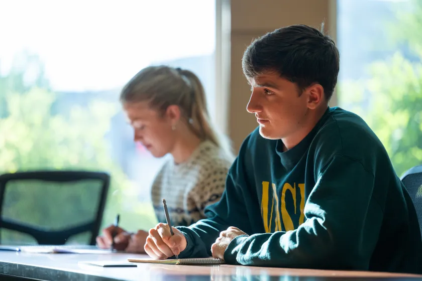 Two students studying in class. 