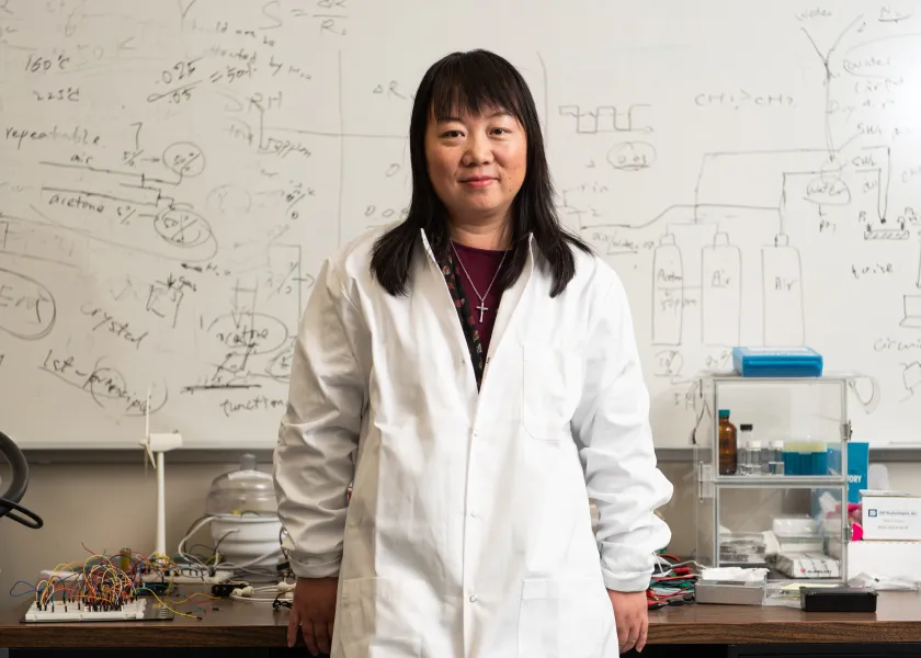 NDSU associate professor of electrical and computer engineering, Danling Wang, poses for a photo in her lab.