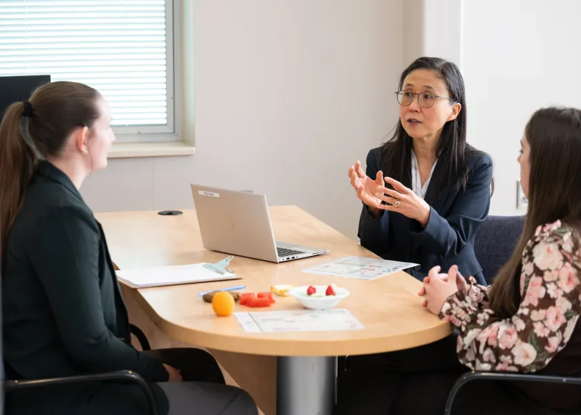 NDSU University Distinguished Professor Yeong Rhee works with her students