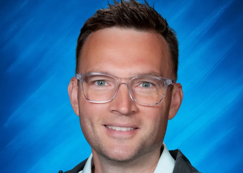 Jim Urlacher, a 2003 graduate of NDSU and Spanish teacher at Discovery Middle School, poses for a headshot.