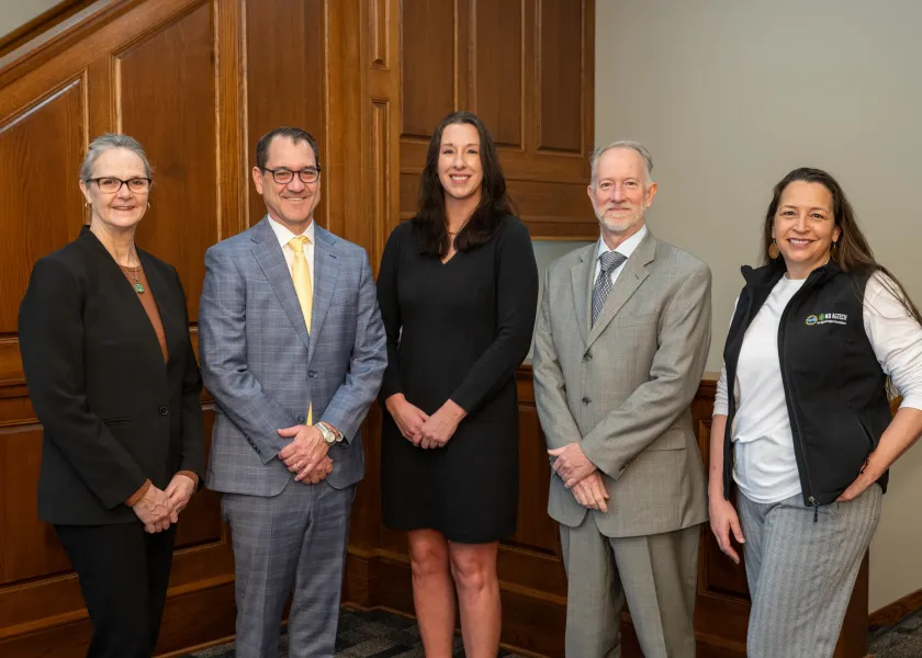 Heidi Grunwald, President Cook, Jessica Jensen, David Luckey and Hollie Mackey stand together for a photo in NDSU's Old Main.