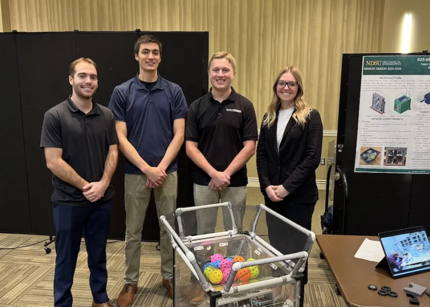 Smart Pickleball Machine engineering team with their product.