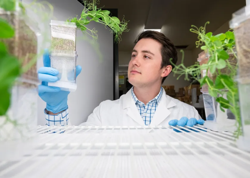 NDSU alum Wyatt Warkenthien working on an experiment