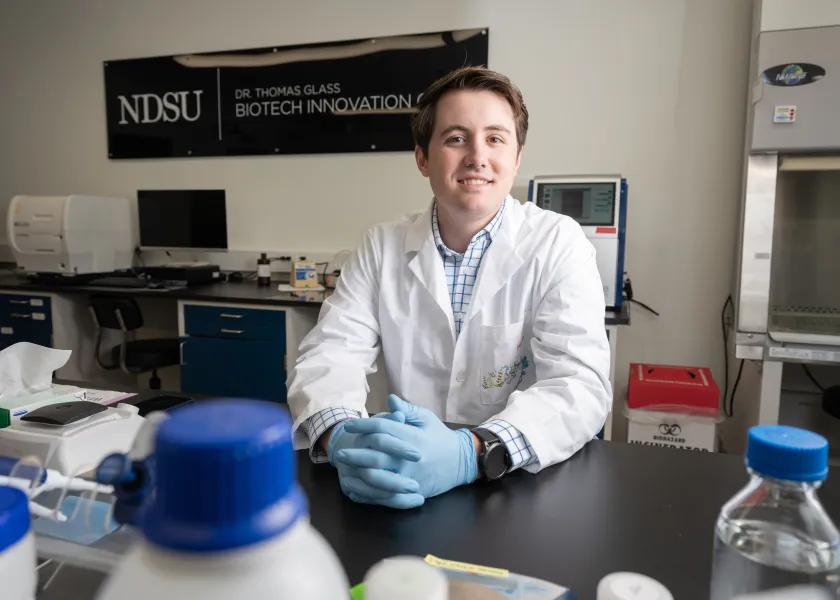 NDSU alum Wyatt Warkenthien in a lab