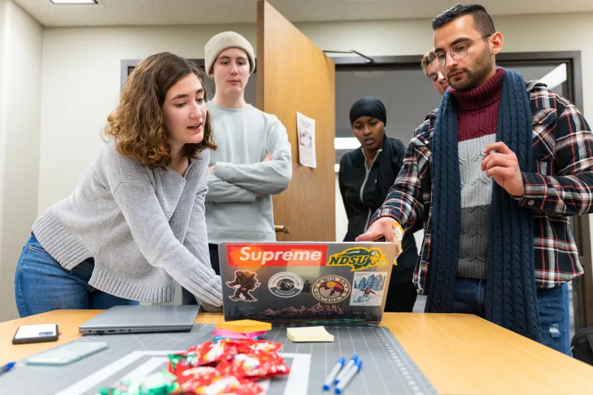 students work together on a project during class