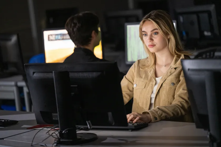 female student at computer in a computer lab