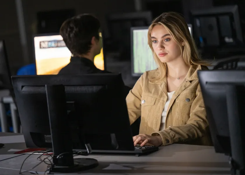 female student at computer in a computer lab