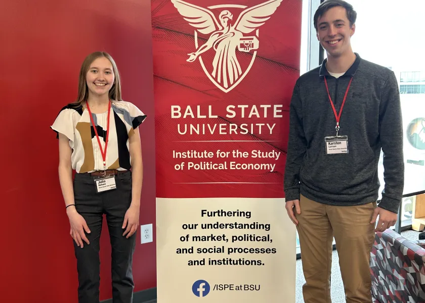 Two undergrads at a conference at Ball State University sponsored by the Challey Institute