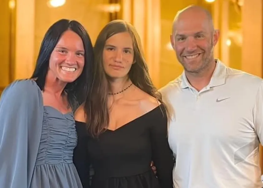 Aleisha Lokken, director of allied sciences and recruitment and retention, poses for a photo with her husband and daughter.