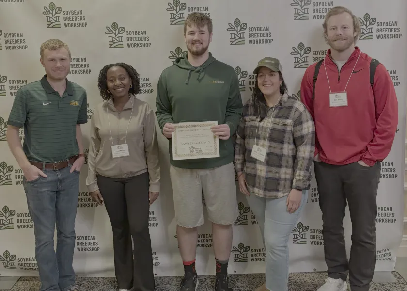 Award winner Sawyer Goodwin and four other teammembers smiling