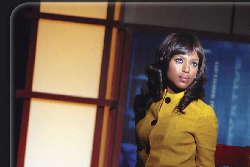 Kerry Washington staring off camera, sitting on a chair