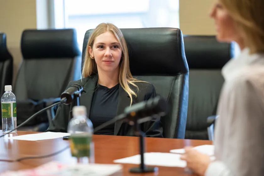 student interviewing an entrepreneur as part of a business podcast