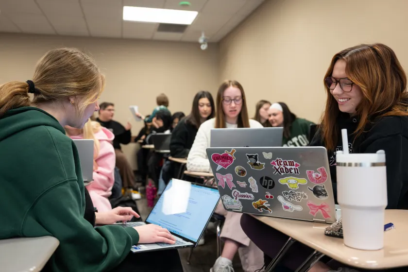Political Science students working on laptops during class