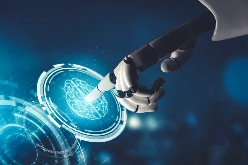 robot hand pointing at LED image of brain