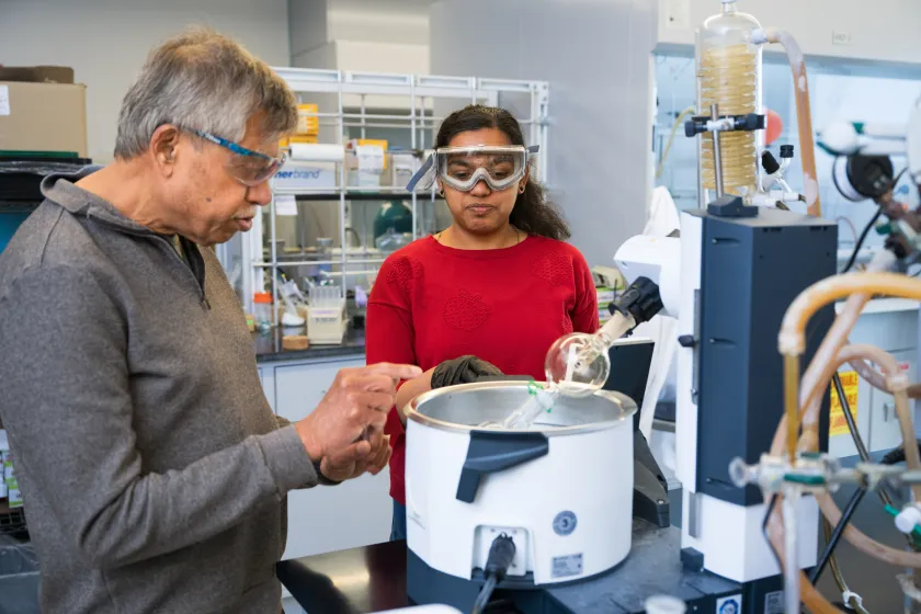 NDSU professor Mukund Sibi works with a Chemistry student