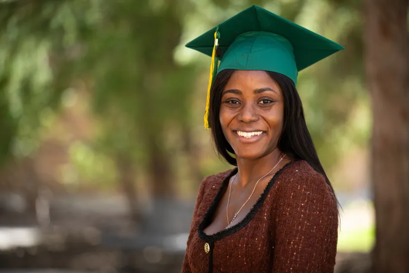 Akua Osei-Bonsu, who is graduating with a master's in public health, poses for a photo.