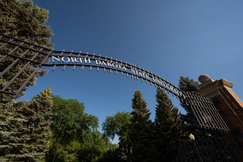 A sign that says North Dakota State University on the main gates.