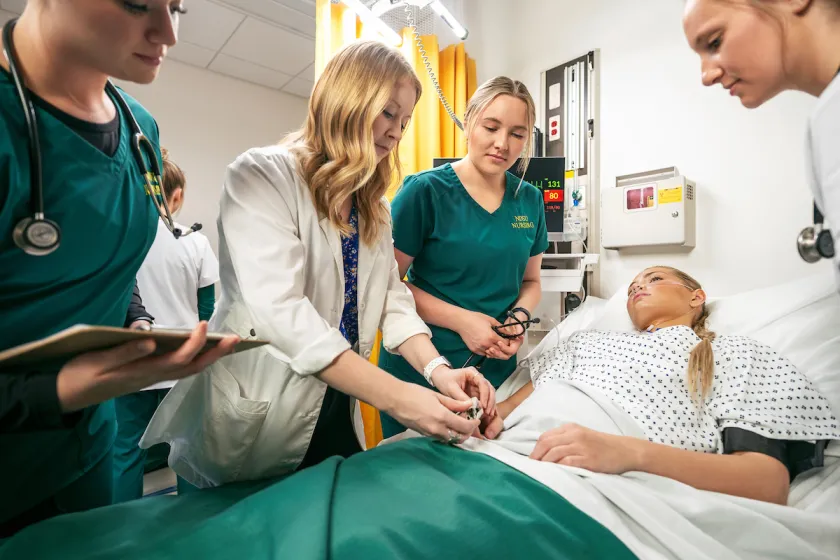 NDSU nursing students attend to a fellow student posing as a patient.