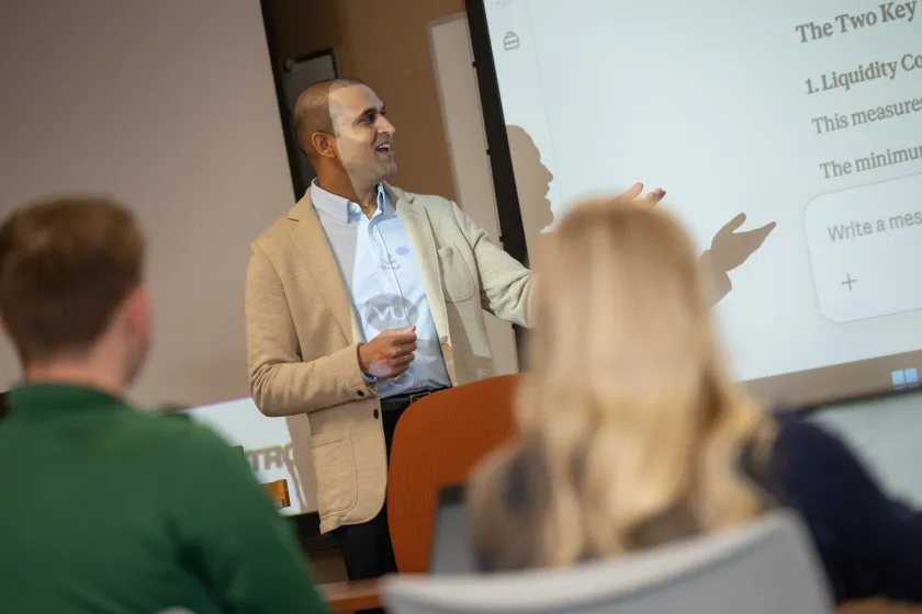faculty member in Management Information Systems teaches class