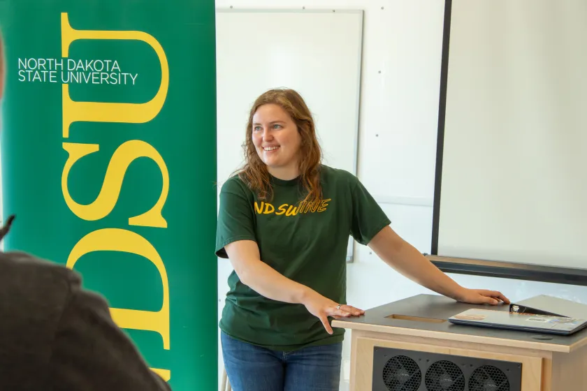 NDSU Swine representative at barn opening.