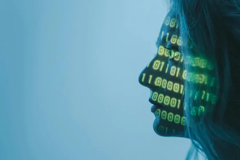 close up of face with code numbers projected on it