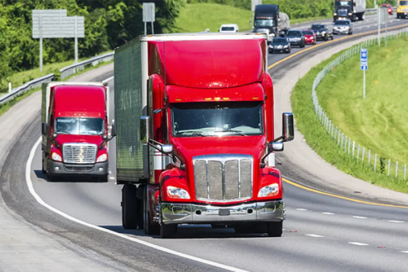 semi-trucks on a road.