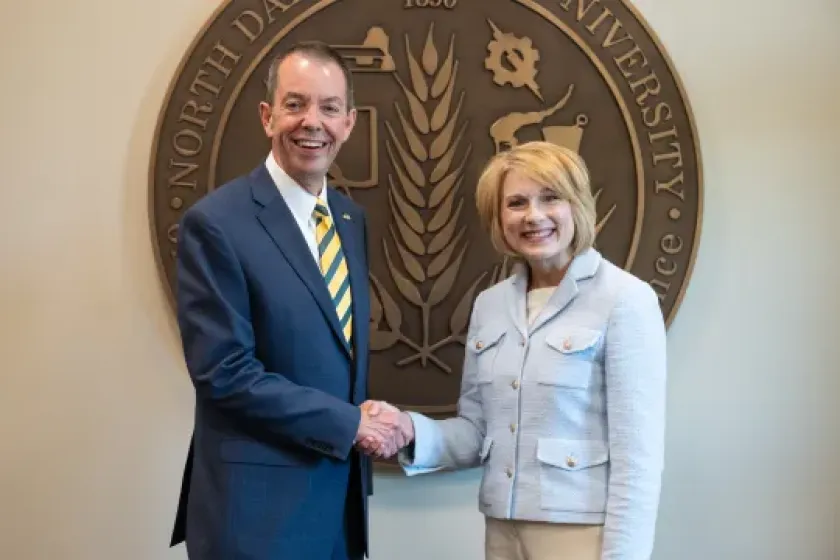 NDSU President Marshall Stewart and Sanford Health Fargo CEO Tiffany Lawrence shake hands