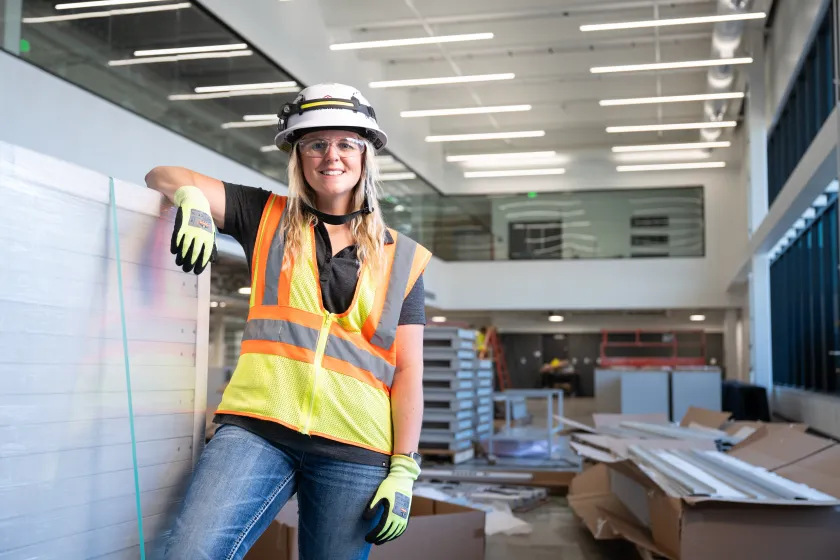 Lexie Grandalen, a 2017 construction management alum who now is the superintendent of McGough Construction, poses for a photo in the new Richard Offerdahl '65 Engineering Complex.