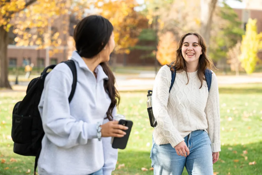 students talk as they walk through the NDSU campus