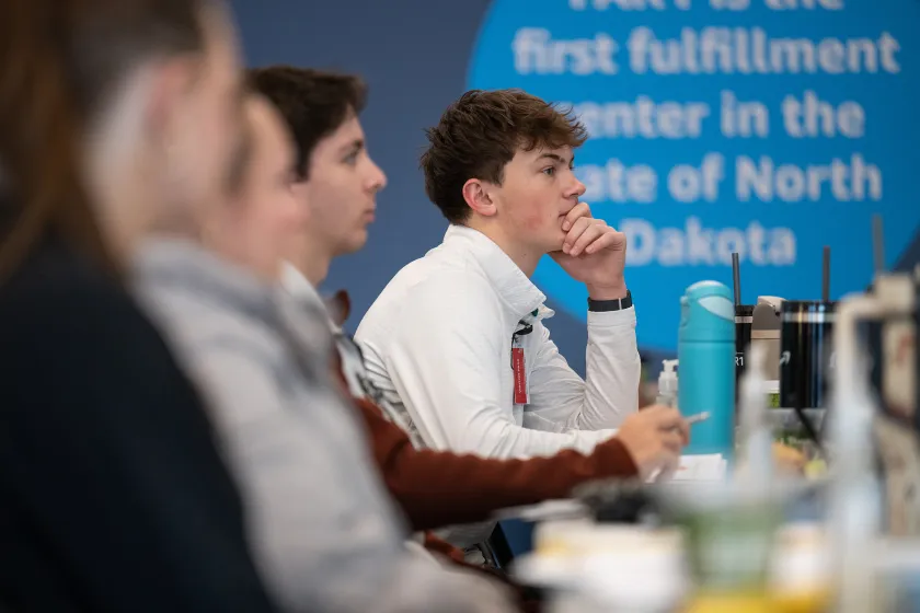 business students listening to community professionals