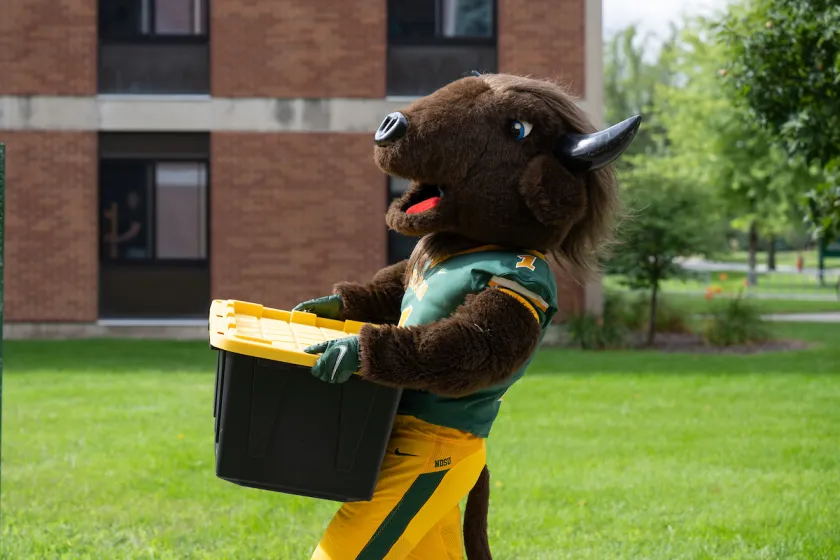 NDSU's Thundar carrying a load to the dorms during Move-In Day.