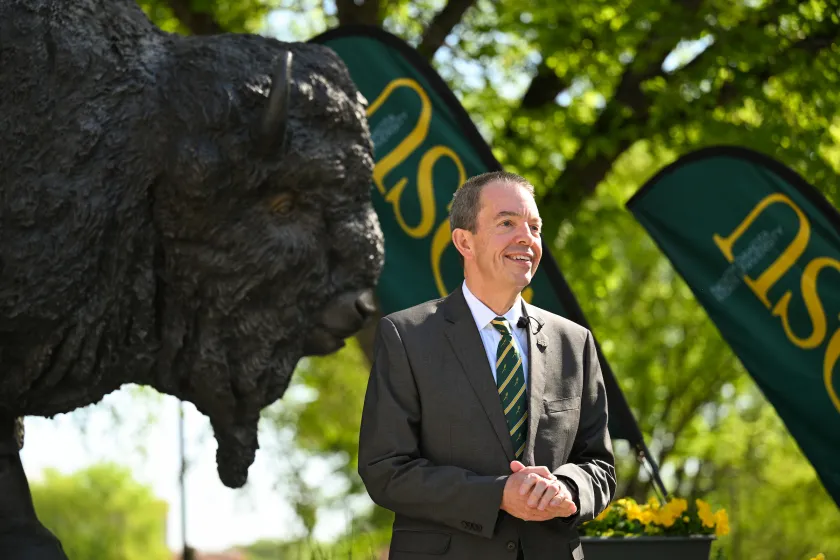 NDSU President Stewart speaks at a press conference 
