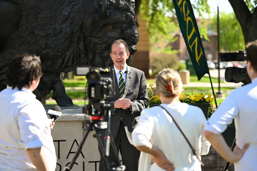NDSU President Stewart speaks at a press conference 
