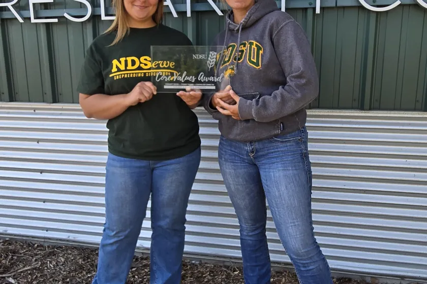 Co-workers show their award.