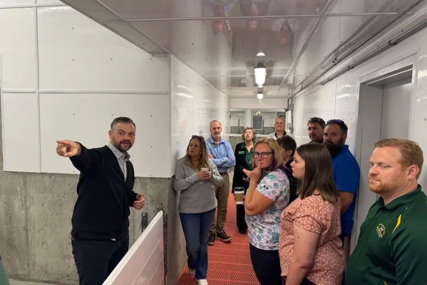 People take a tour of the swine barn.
