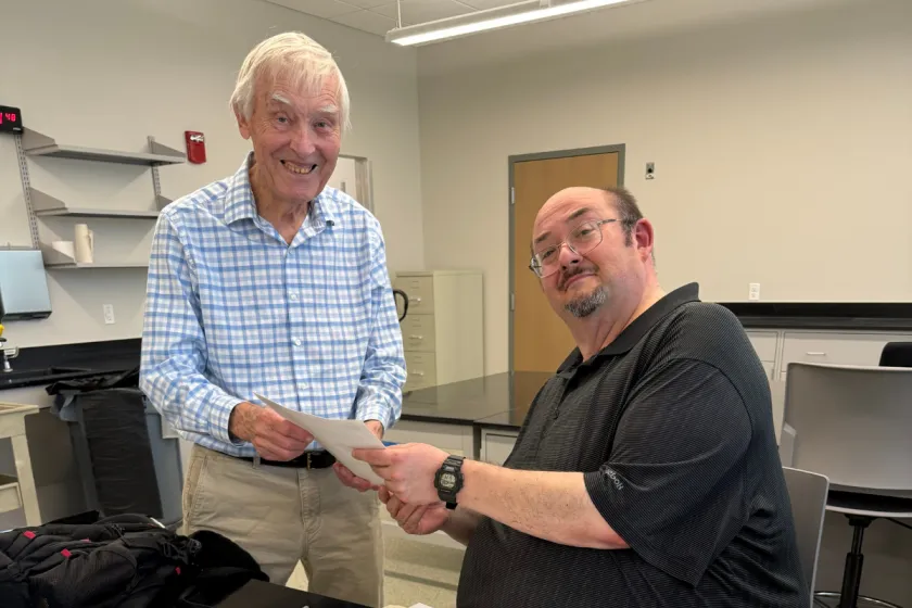 Allan Ashworth (left) and Floyd Shockley (right) celebrate the transfer of the bug collection to the Smithsonian.
