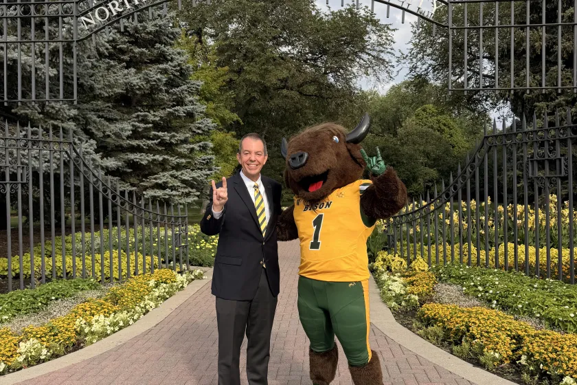 President Stewart poses with Thundar at the gates