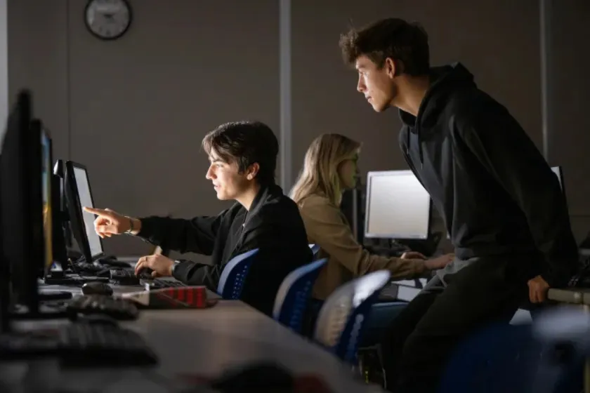 NDSU students work together at computers.